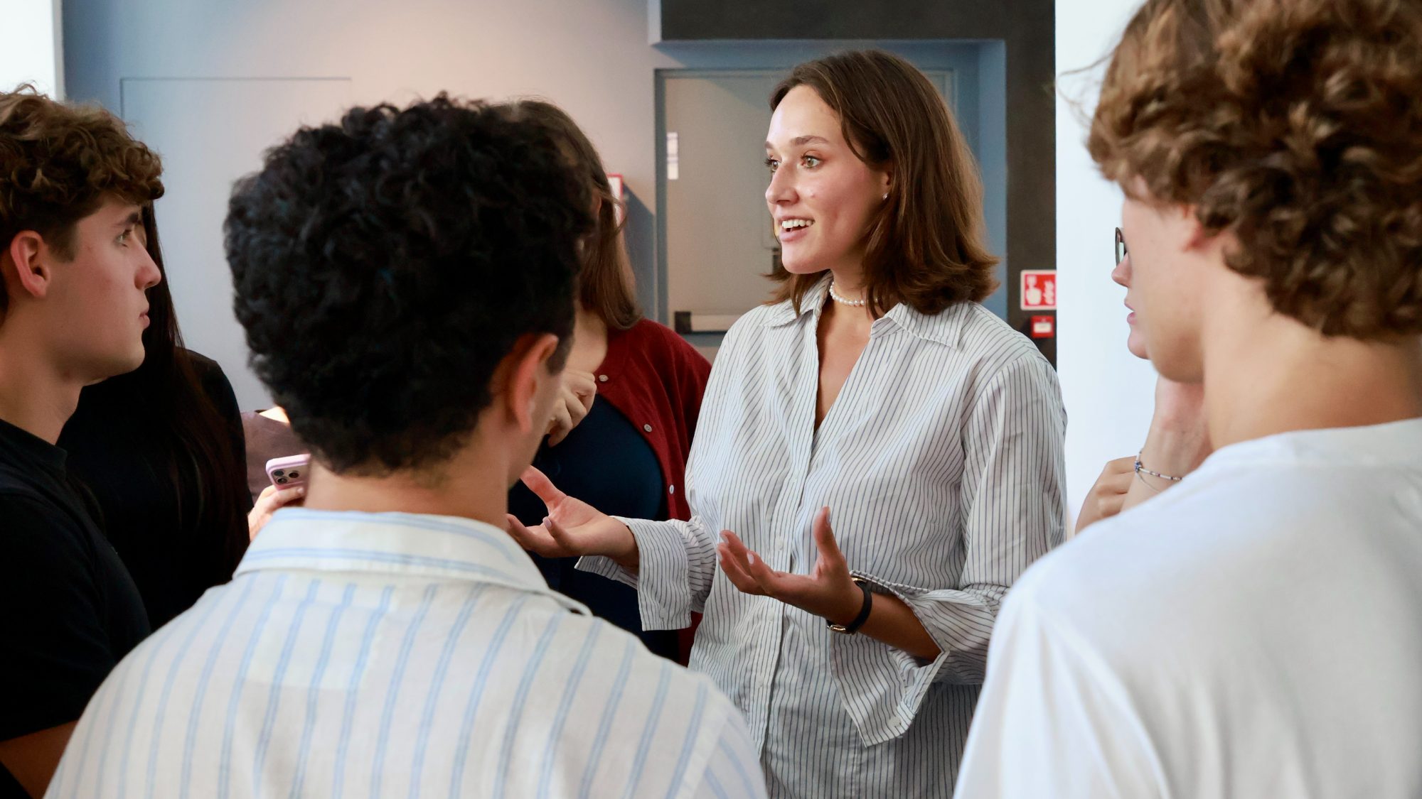 An ambassador talking with a group of students