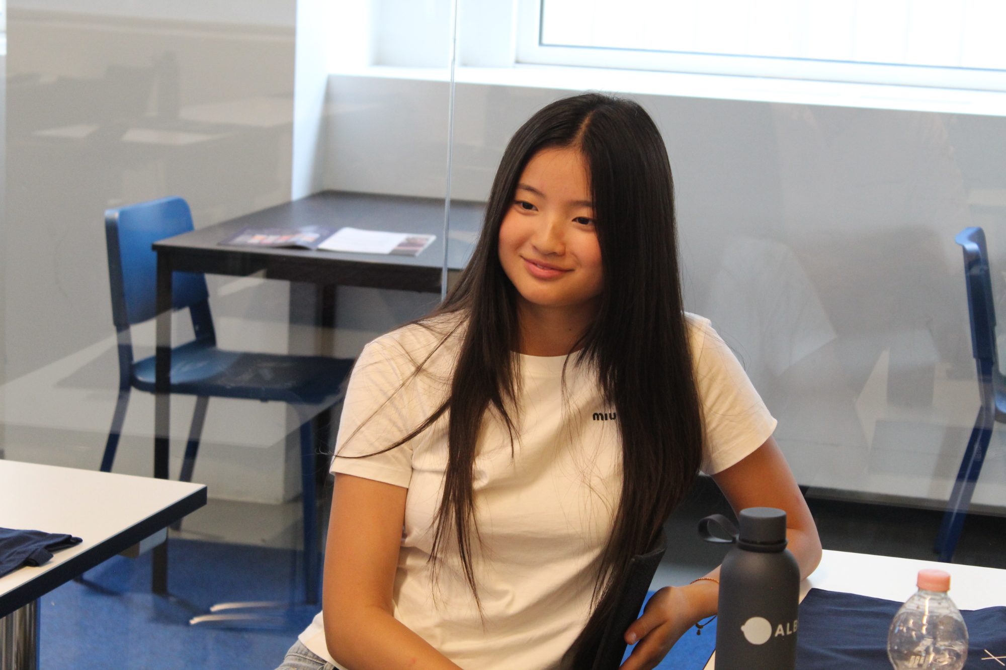 A student smiling during a workshop