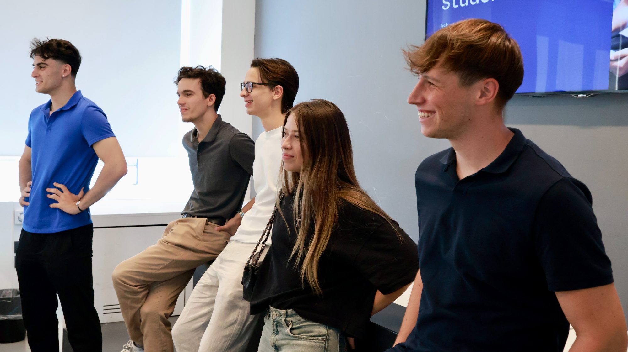 Five students smiling together at the end of a workshop